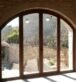 Finestra d'un client particular, ha incorporat una balconera amb forma